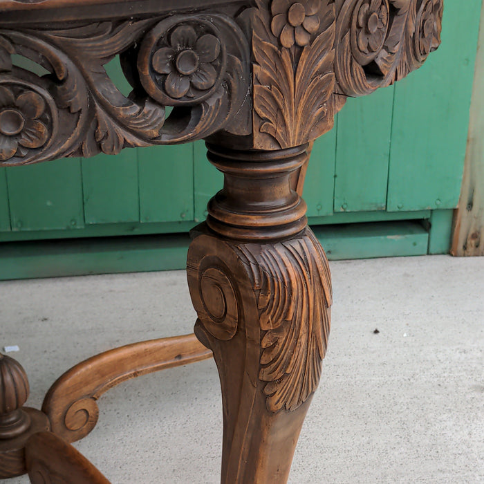 ROUND CARVED OAK LOW OCCASIONAL TABLE, WITH PAW FEET