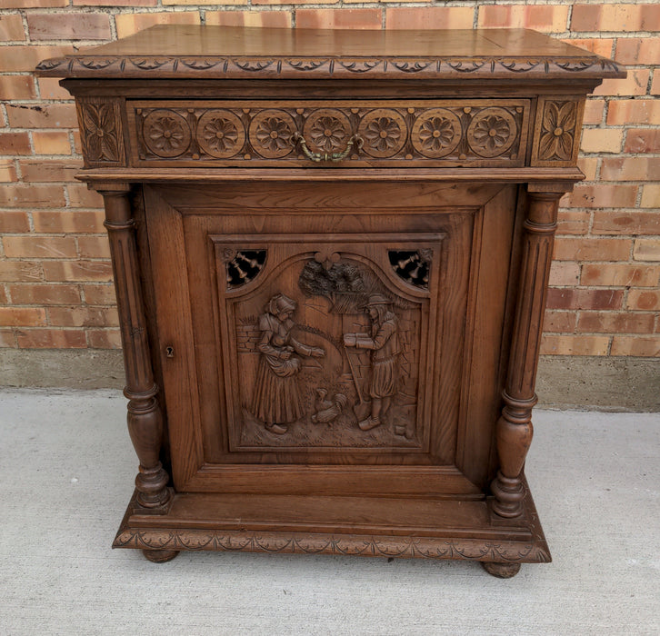 FRENCH BRETON FIGURAL CARVED OAK CONFITURIER