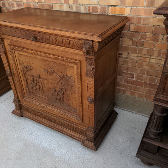 OAK FIGURAL CARVED SINGLE DOOR CABINET WITH LION HEADS