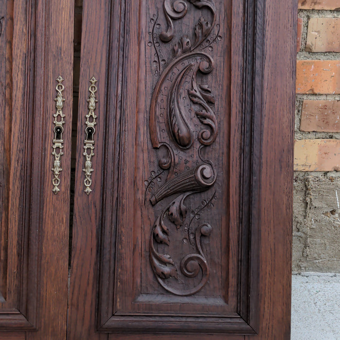 PAIR OF HENRI II CARVED OAK HUNT SCENE NARROW CABINET DOORS