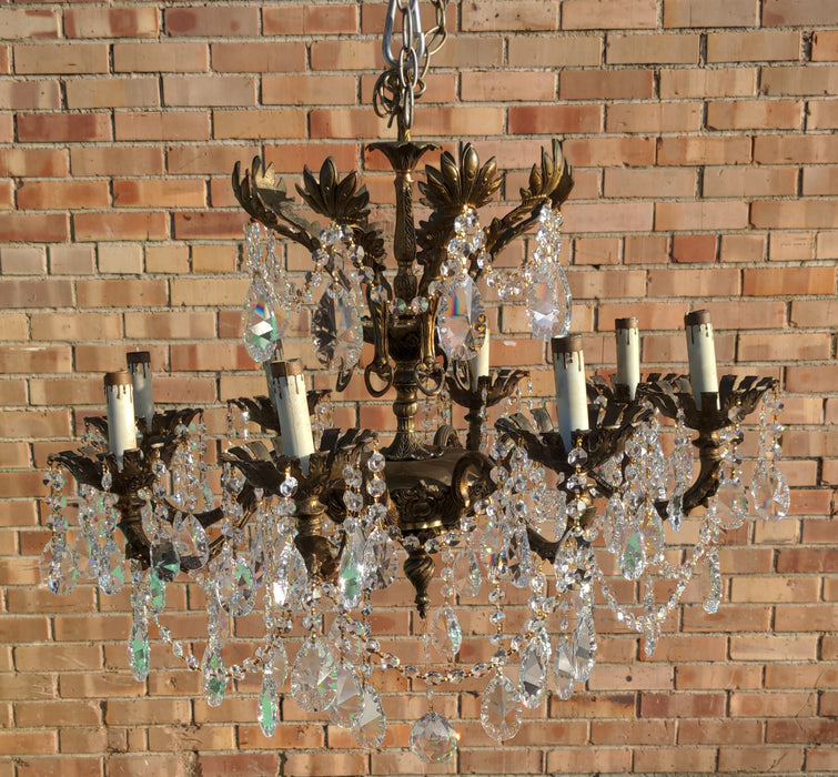 SPANISH EIGHT LIGHT BRASS AND CRYSTAL CHANDELIER