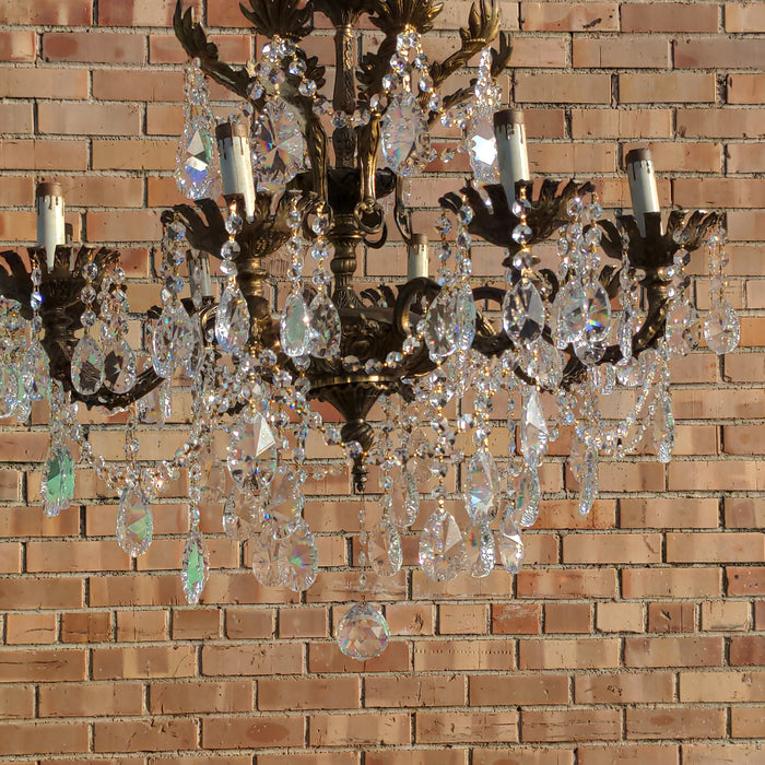 SPANISH EIGHT LIGHT BRASS AND CRYSTAL CHANDELIER