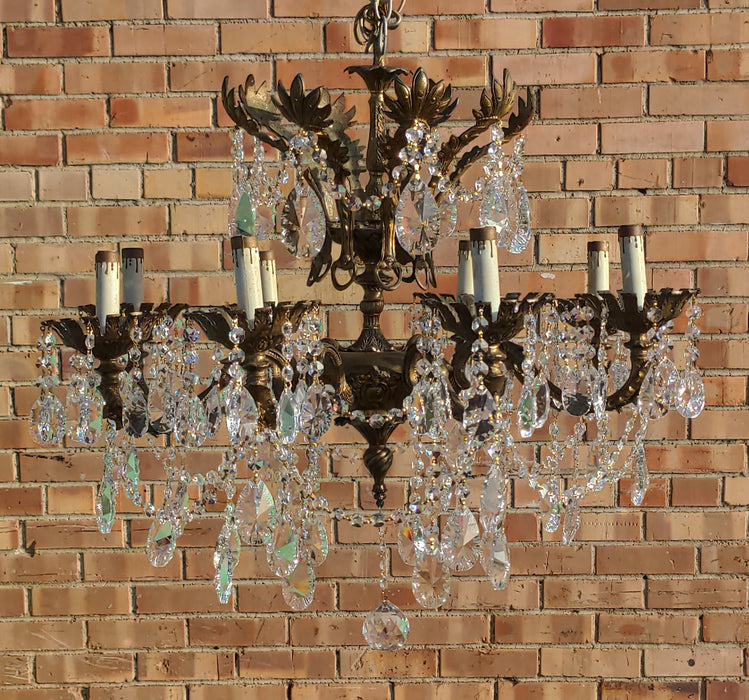 SPANISH EIGHT LIGHT BRASS AND CRYSTAL CHANDELIER