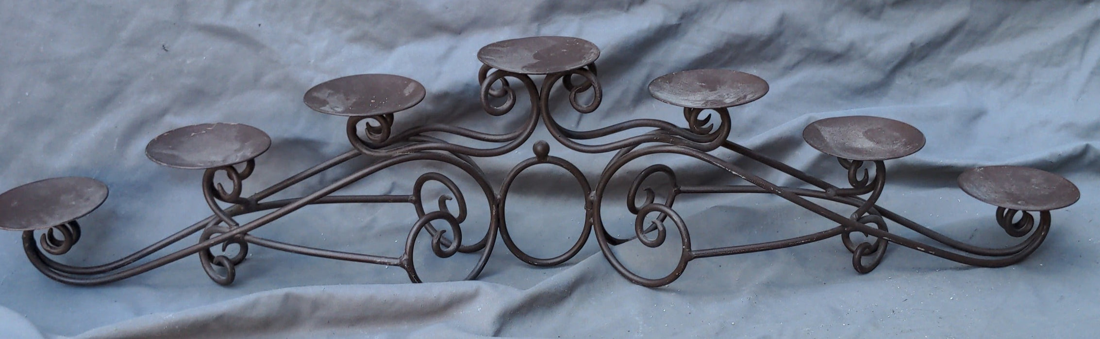 SEVEN LIGHT BENT IRON ARCHED CANDLE STAND