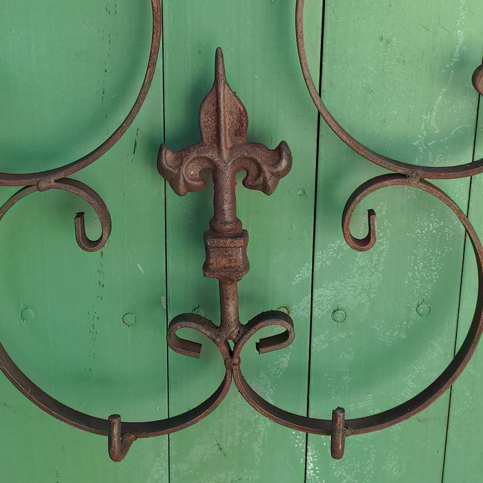 PAIR OF IRON FLEUR-DE-LIS WALL HANGERS