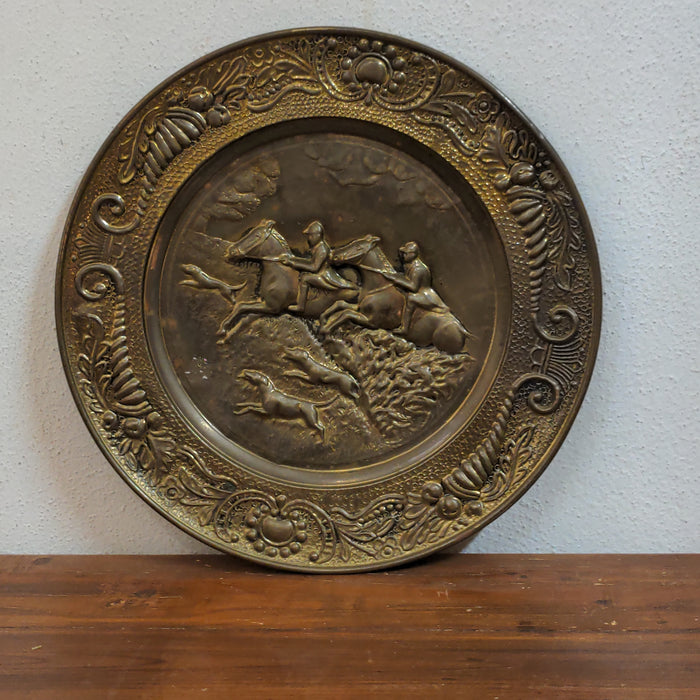 BRASS CHARGER WITH EMBOSSED HORSE RIDERS