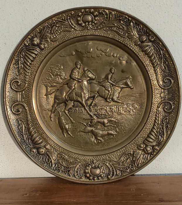 BRASS CHARGER WITH EMBOSSED HORSE RIDERS