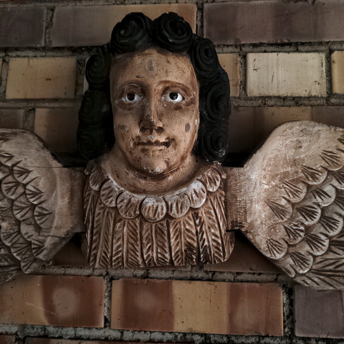 SOUTH AMERICAN CARVED WOOD ANGEL WITH GLASS EYES