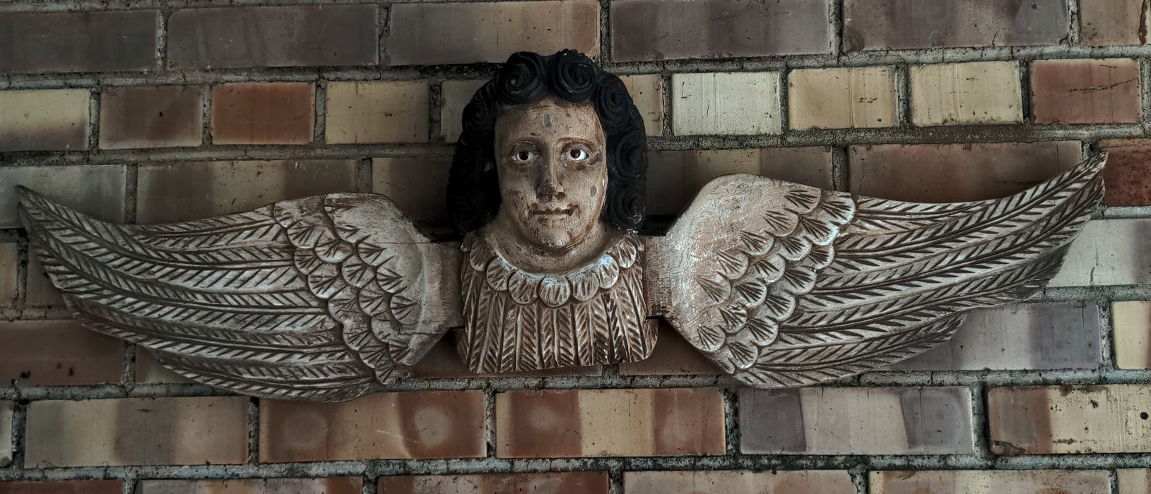 SOUTH AMERICAN CARVED WOOD ANGEL WITH GLASS EYES