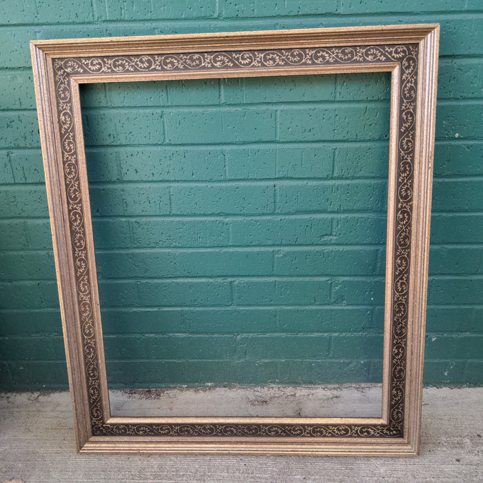 GOLD AND BLACK FRAME WITH DETAIL