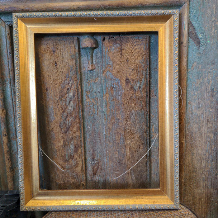 GOLD LEAF FRAME WITH GADROONING returned to consignor
