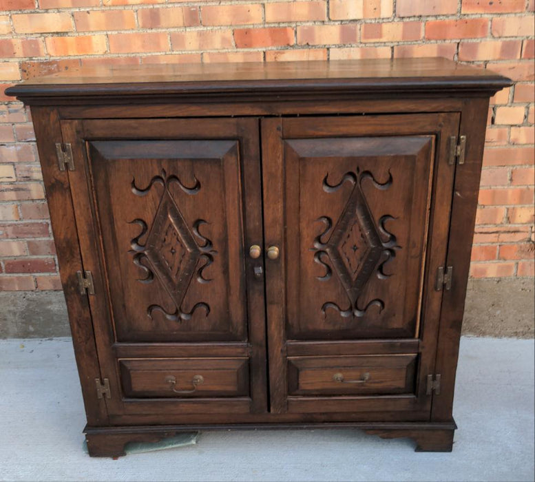 CARVED OAK TWO-DOOR AND TWO-DRAWER CABINET