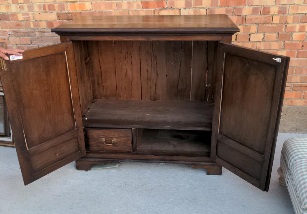 CARVED OAK TWO-DOOR AND TWO-DRAWER CABINET