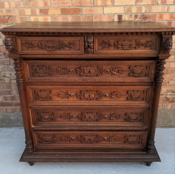 SIX DRAWER FRENCH OAK CHEST WITH HEADS