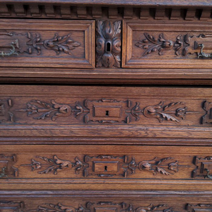 SIX DRAWER FRENCH OAK CHEST WITH HEADS