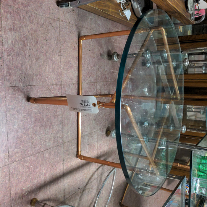 MODERN ROUND GLASS TOP TABLE WITH SQUARE COPPER BASE SMALL CHIP ON GLASS