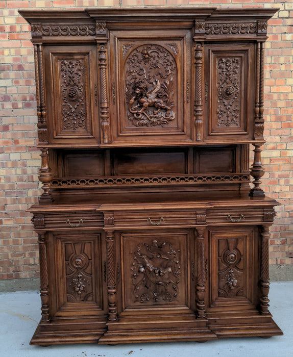 CARVED HENRI II WALNUT BUFFET WITH CHIMERA AND SERPENT