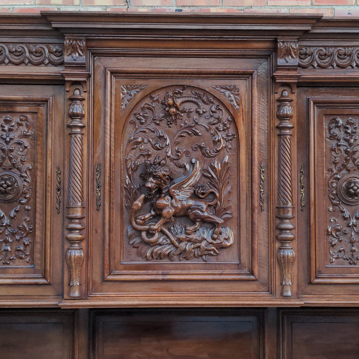 CARVED HENRI II WALNUT BUFFET WITH CHIMERA AND SERPENT