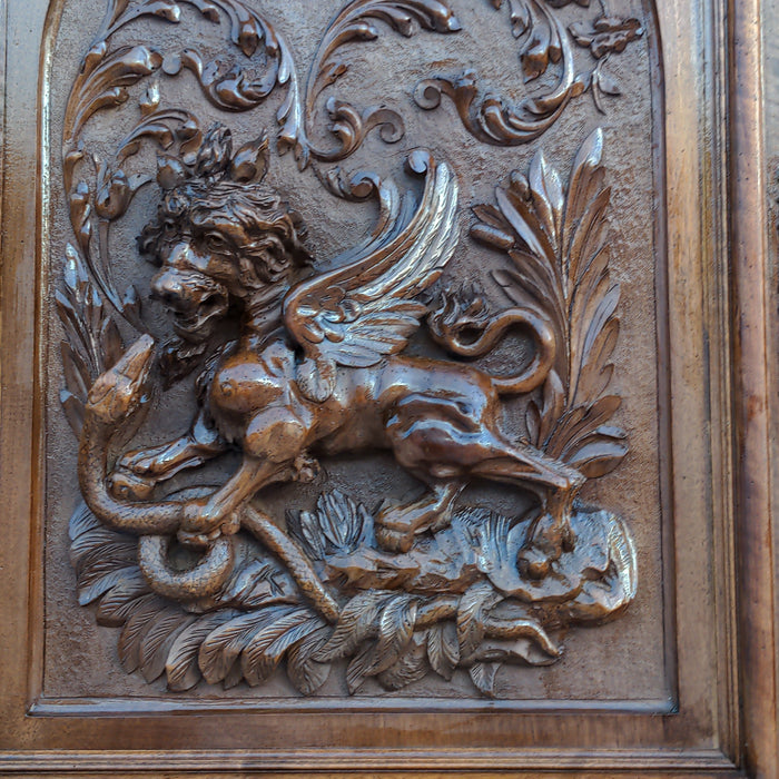 CARVED HENRI II WALNUT BUFFET WITH CHIMERA AND SERPENT