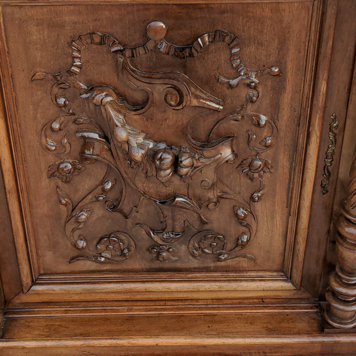 CARVED HENRI II WALNUT BUFFET WITH CHIMERA AND SERPENT