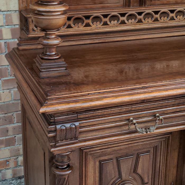 CARVED HENRI II WALNUT BUFFET WITH CHIMERA AND SERPENT