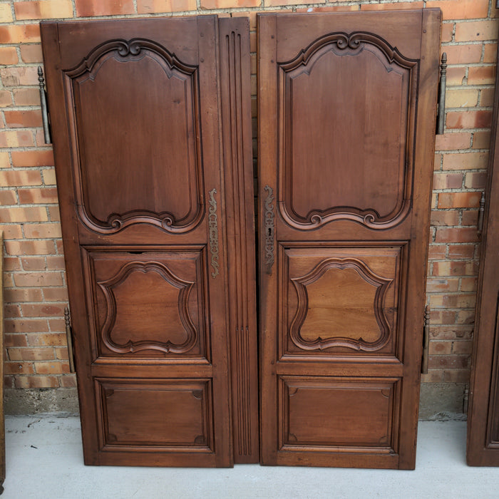 PAIR OF FRENCH WALNUT 3-PANEL DOORS