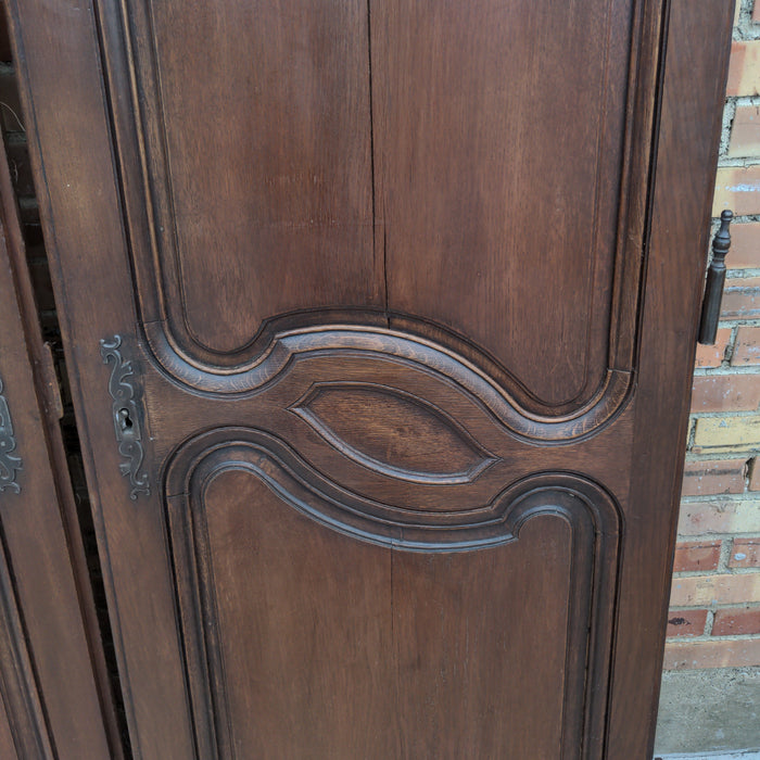PAIR OF FRENCH WALNUT TWO-PANEL DOORS