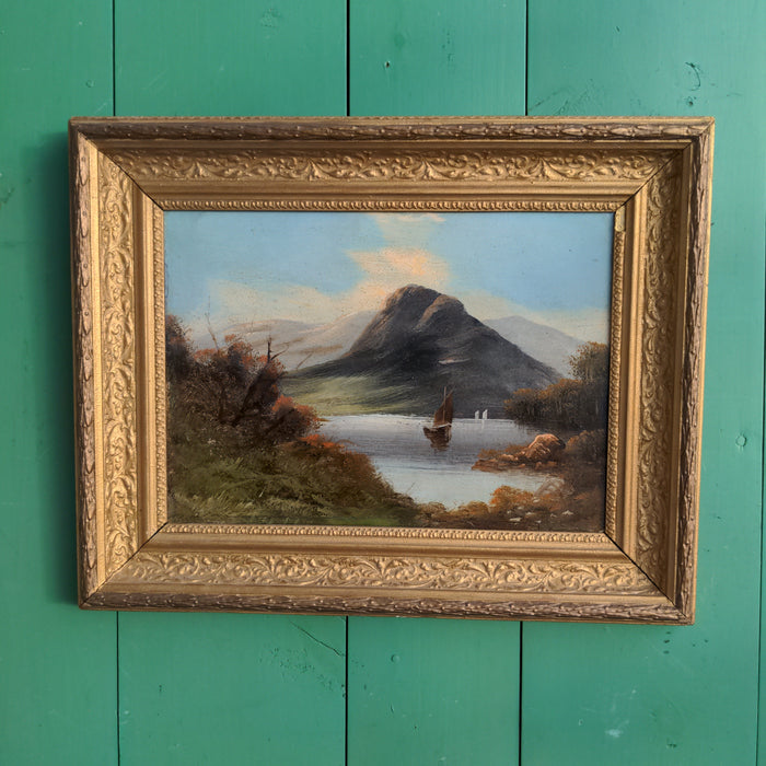 OIL PAINTING ON BOARD OF A BOAT IN LAKE BY A MOUNTAIN