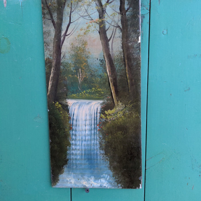 VERTICAL OIL PAINTING OF A WATERFALL ON BOARD