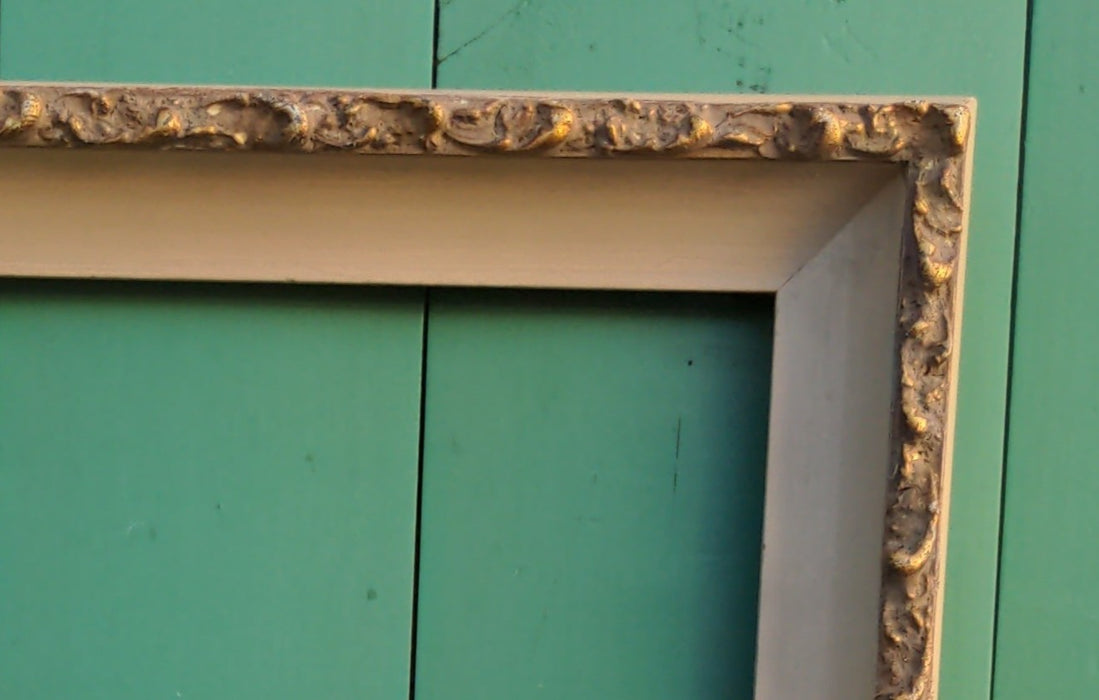 GILT FRAME WITH BEIGE CARVED ROCOCO EDGE