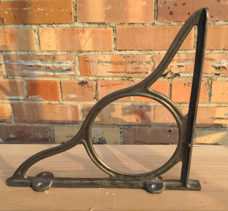 PAIR OF ORNAMENTAL IRON SHELF BRACKETS