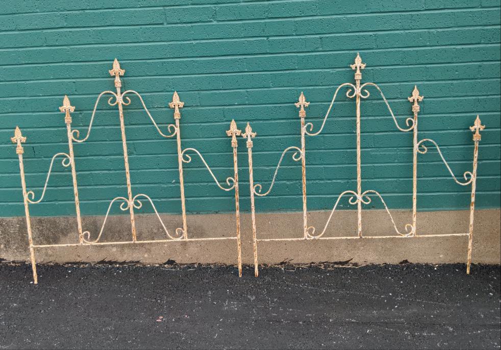 PAIR OF IVORY TWIST IRON FENCE PANELS WITH FIVE FINIALS