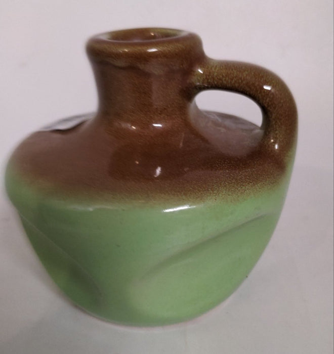 GREEN AND BROWN POTTERY JUG MK CANDLES SYRACUSE NEW YORK