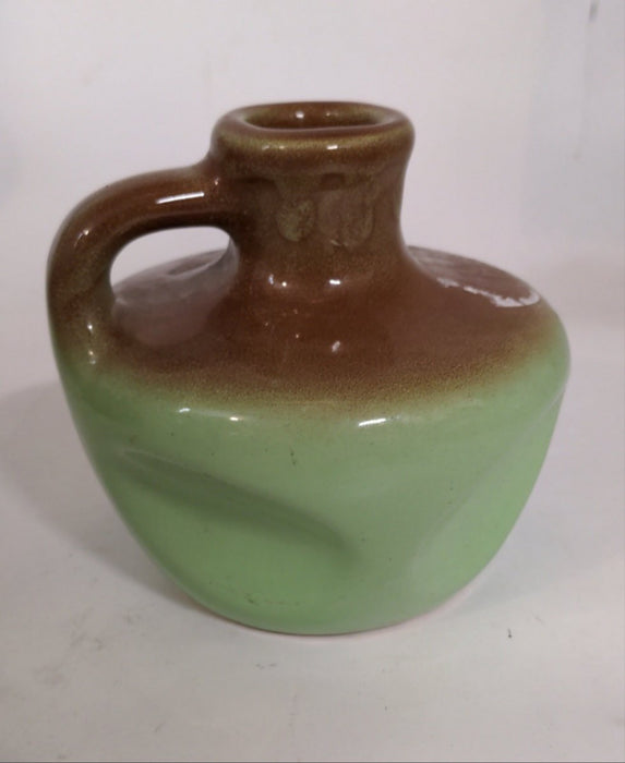 GREEN AND BROWN POTTERY JUG MK CANDLES SYRACUSE NEW YORK