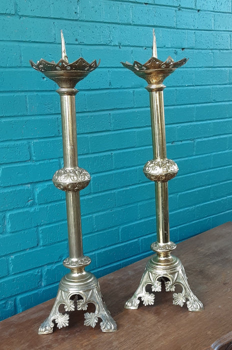 PAIR OF BRASS PRICKETTS (CANDLE STANDS) AS FOUND