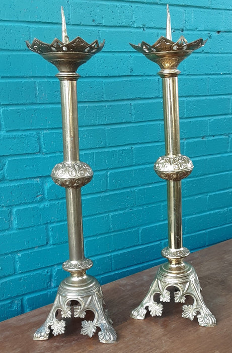 PAIR OF BRASS PRICKETTS (CANDLE STANDS) AS FOUND