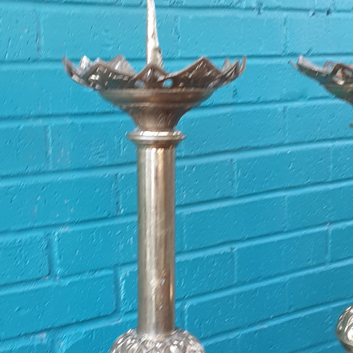 PAIR OF BRASS PRICKETTS (CANDLE STANDS) AS FOUND