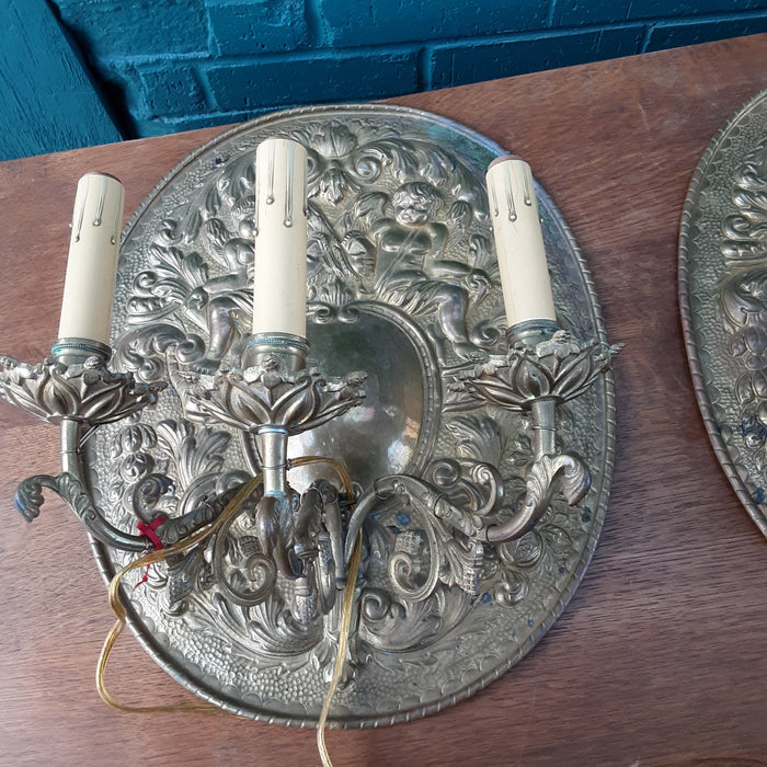 PAIR OF BRASS CHERUB PLAQUES WITH ELECTRIFIED SCONCES