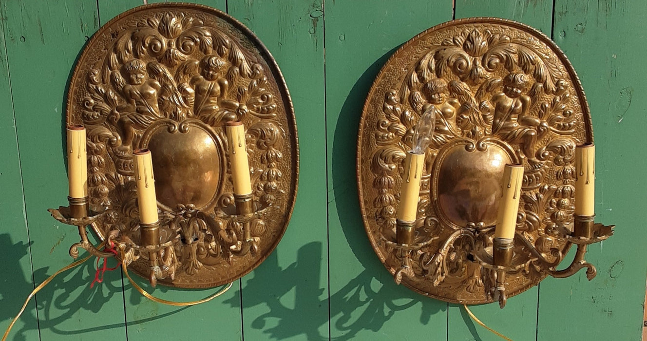 PAIR OF BRASS CHERUB PLAQUES WITH ELECTRIFIED SCONCES