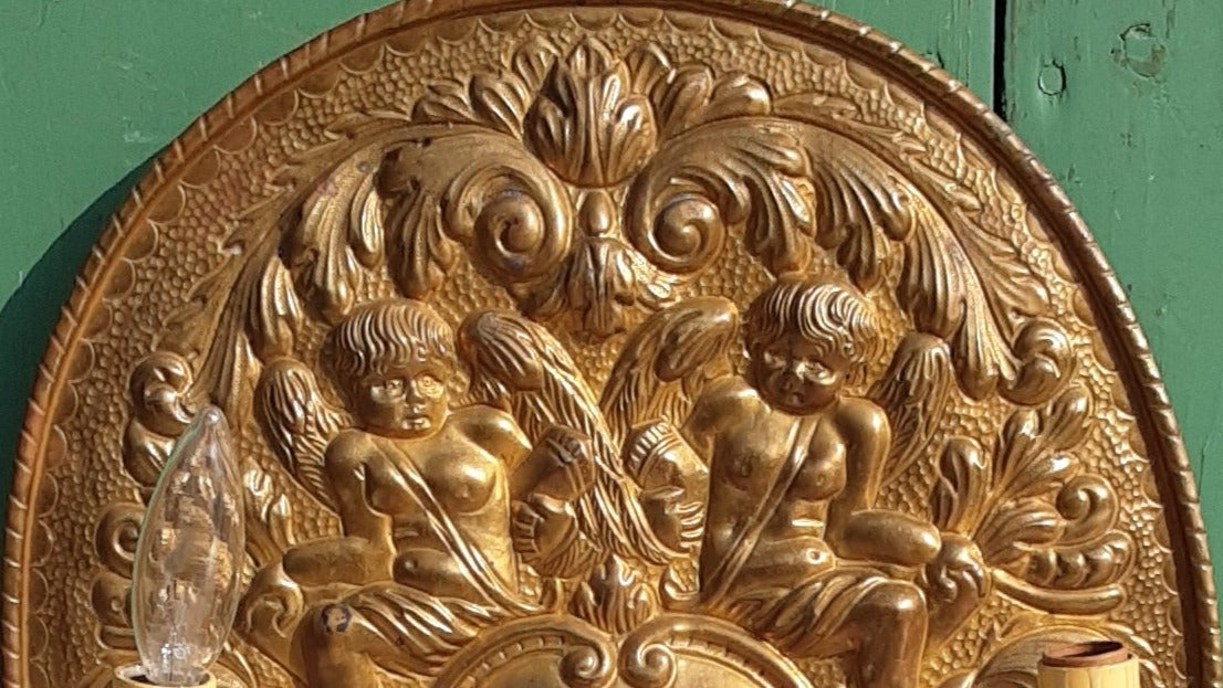 PAIR OF BRASS CHERUB PLAQUES WITH ELECTRIFIED SCONCES