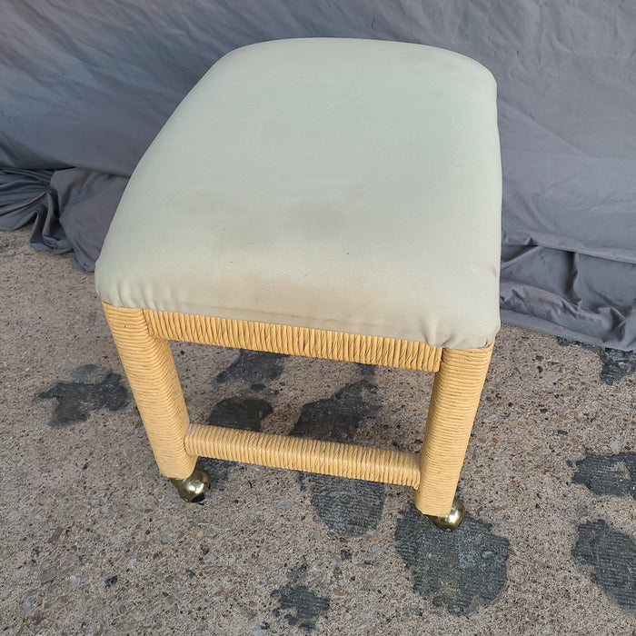 UPHOLSTERED WICKER STOOL ON CASTERS