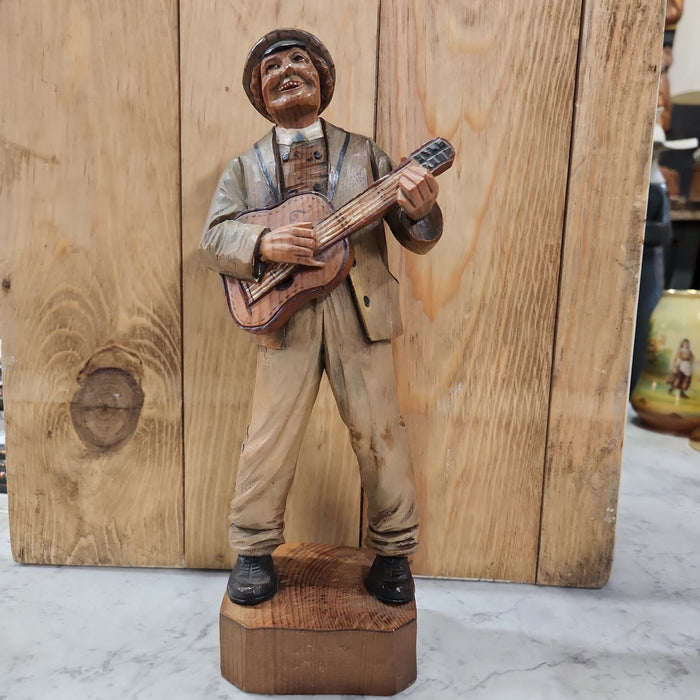 WOOD SWISS CARVING OF GUITARMAN