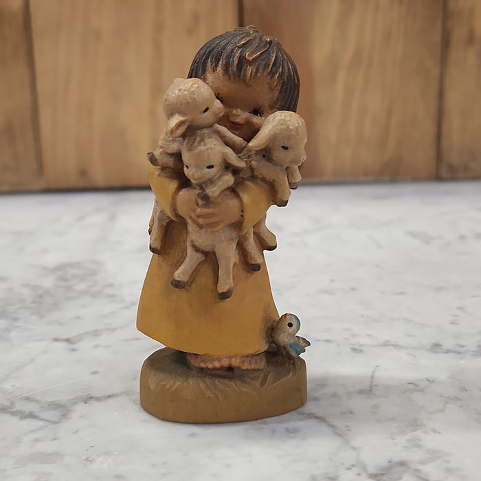 WOOD CARVING OF A GIRL WITH LAMBS