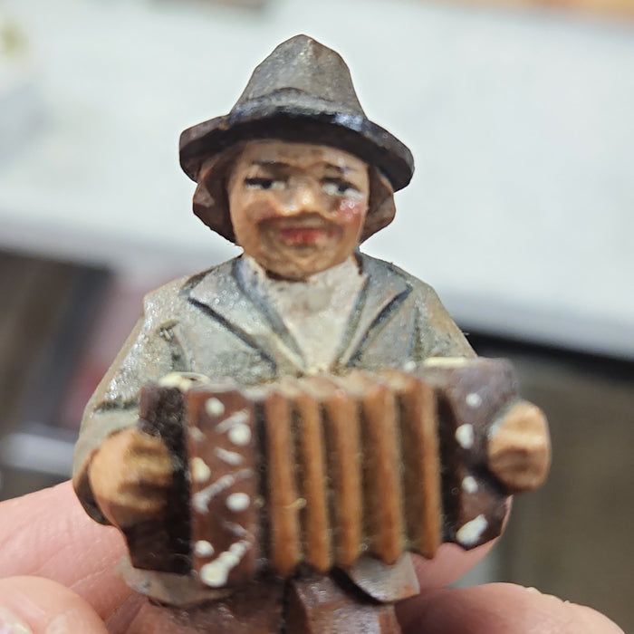 WOOD CARVING OF ACCORDIAN PLAYER MAN
