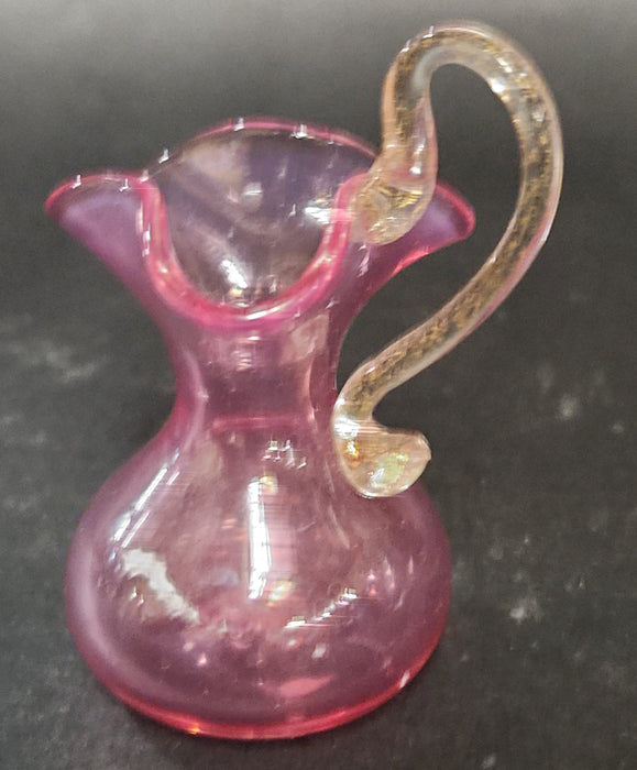 SMALL ART GLASS HAND BLOWN PINK AND CLEAR PITCHER