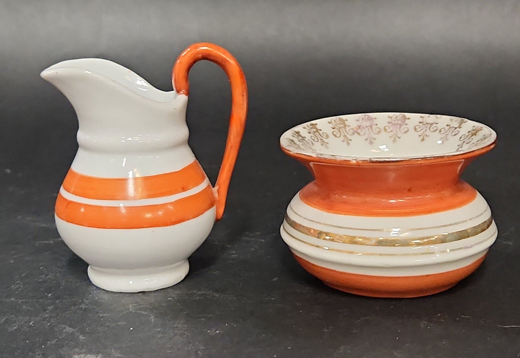 2 PIECE ORANGE AND WHITE MINIATURE BOWL AND PITCHER