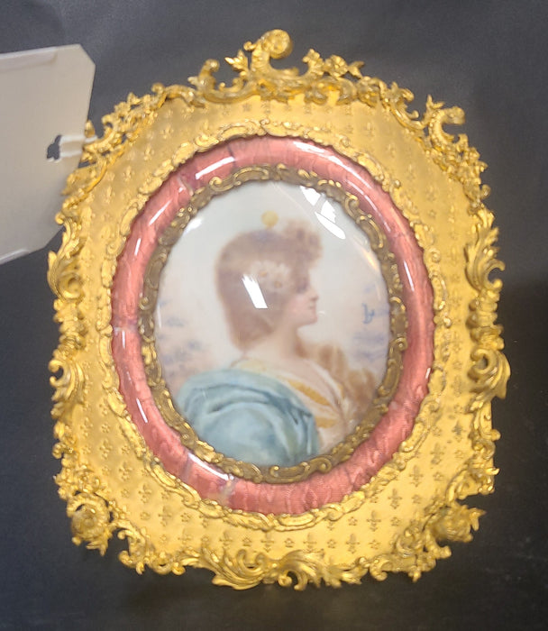 SIGNED LOUIS XVI ORNATE FRAMED BRASS LADY PAINTING
