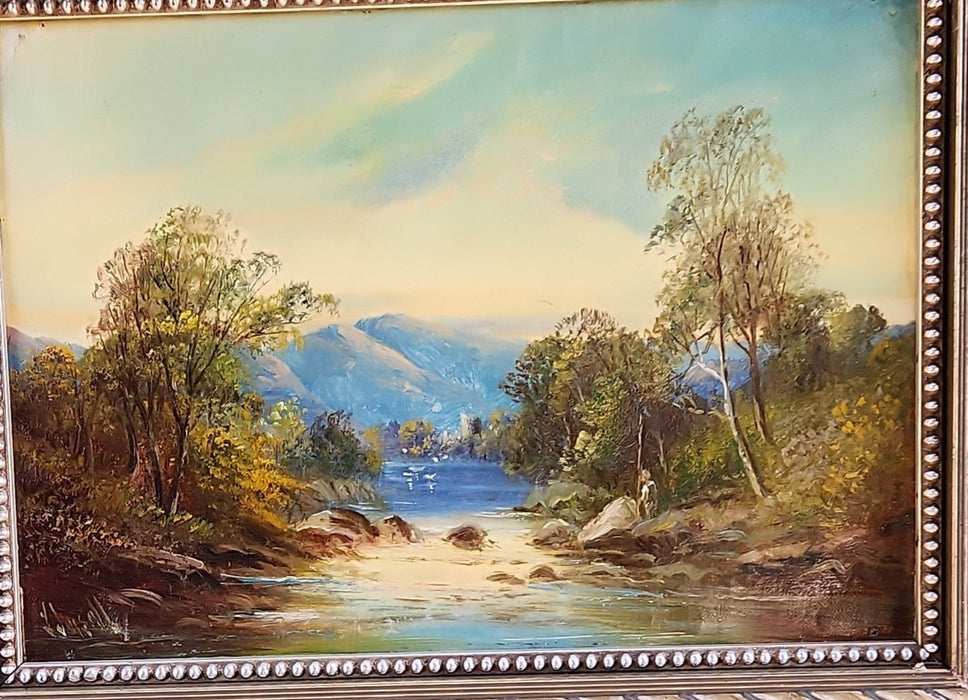 SILVER FRAMED OIL PAINTING OF A CASTLE BY A STREAM-SIGNED