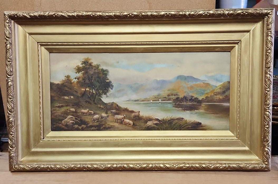 GOLD FRAMED OIL PAINTING OF A FLOCK OF SHEEP BY A LAKE-SIGNED