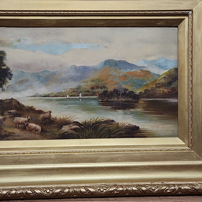 GOLD FRAMED OIL PAINTING OF A FLOCK OF SHEEP BY A LAKE-SIGNED